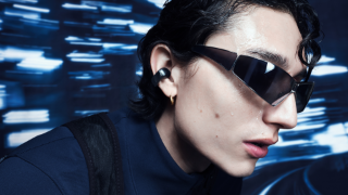 Man wearing Bose Ultra Open Earbuds while exercising
