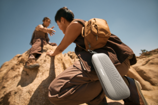 Two friends rock climbing listening to a Bose SoundLink Flex Portable Speaker (2nd Gen)