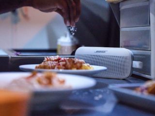 Bose SoundLink Flex (2nd Gen) on a table with food