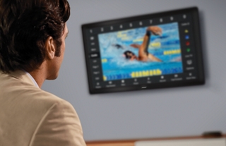 Our achievements Man watching Bose HDTV