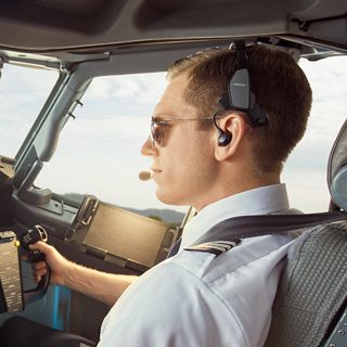 Pilot using the Bose ProFlight Aviation Headset