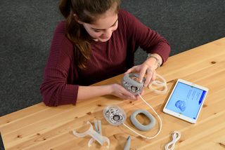 Girl building BOSEbuild Headphones