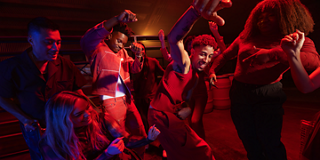 Young people dancing at a party with music playing from a Bose SoundLink Max Portable Speaker