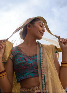 Woman wearing Bose QuietComfort Earbuds II outside