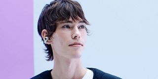 Man wearing Bose Ultra Open Earbuds