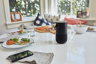 Bose Portable Smart Speaker on a dinner table