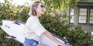 Woman wearing SoundSport Free wireless headphones