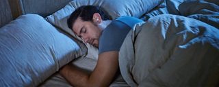 Man sleeping with Bose Sleepbuds II