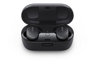 Triple Black Bose QuietComfort Earbuds inside the charging case with the cover open