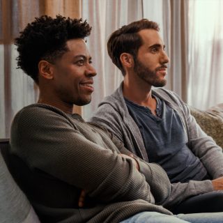 2 men watching TV