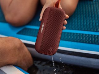 SoundLink Flex Bluetooth speaker being removed from the water