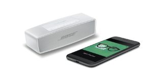 Luxe Silver SoundLink Mini II Special Edition shown with a smartphone