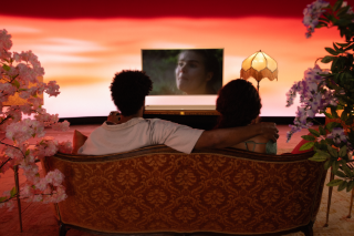 Couple watching TV with a Bose Smart Ultra Soundbar