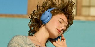 Woman wearing Bose QuietComfort Headphones.