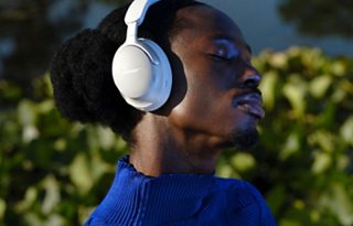 Man wearing Bose QuietComfort Ultra Headphones outside