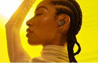 Woman wearing Bose QuietComfort Ultra Earbuds