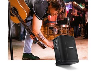 Musician adjusting the S1 Pro+ Wireless PA System